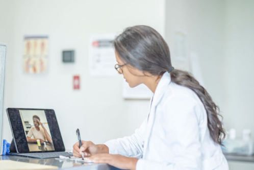 Doctor talking to patient through telehealth