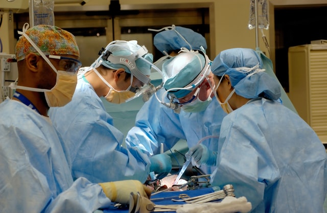 surgeons performing surgery