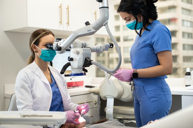 doctor checking patient