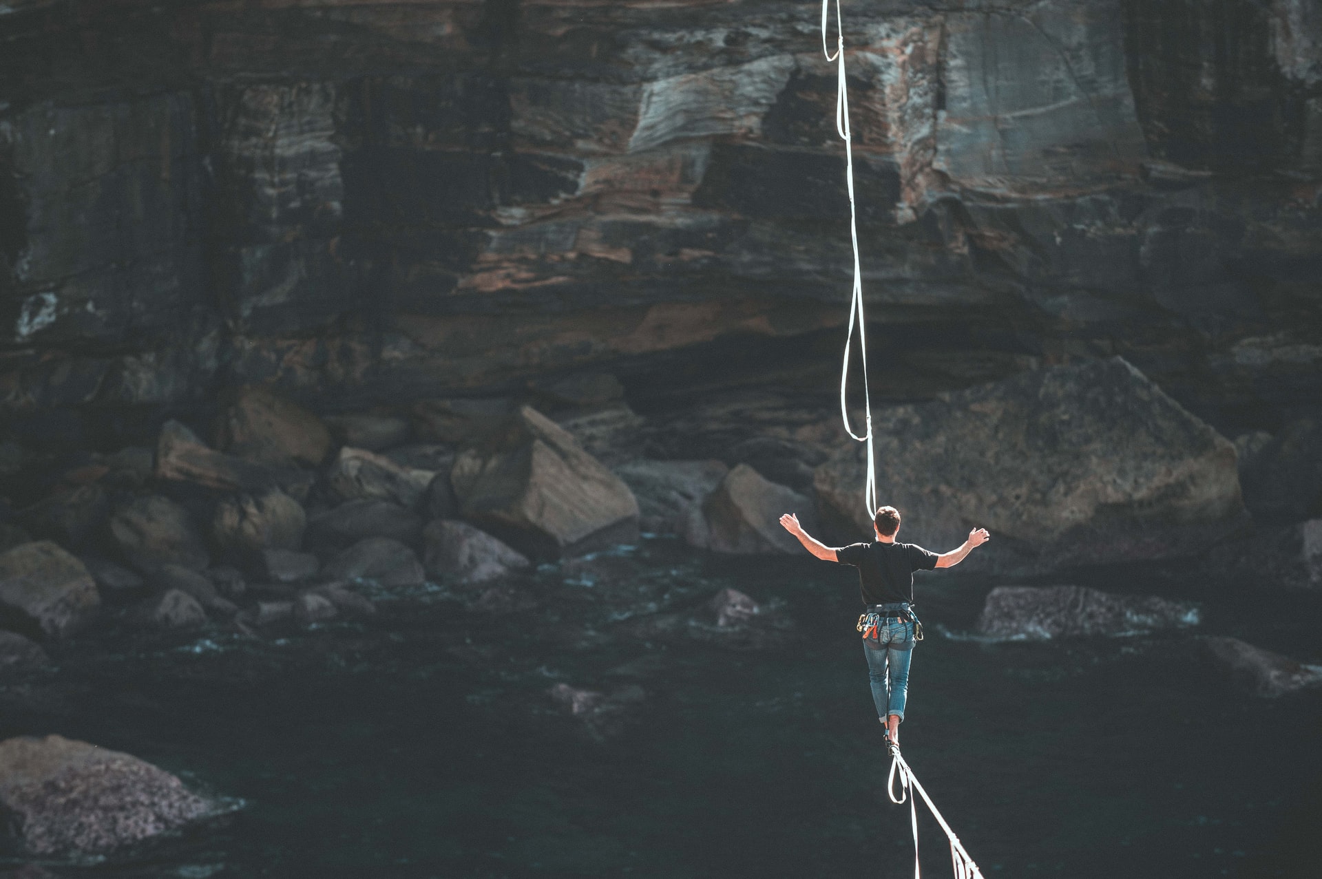 man walking on tightrope
