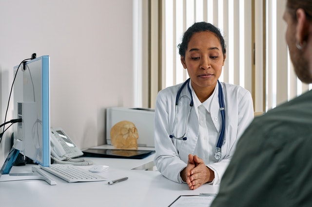 doctor talking to patient about vaccine myths