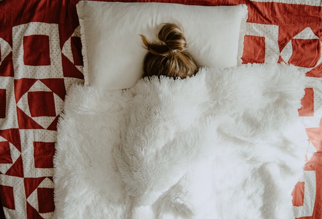 girl laying in bed