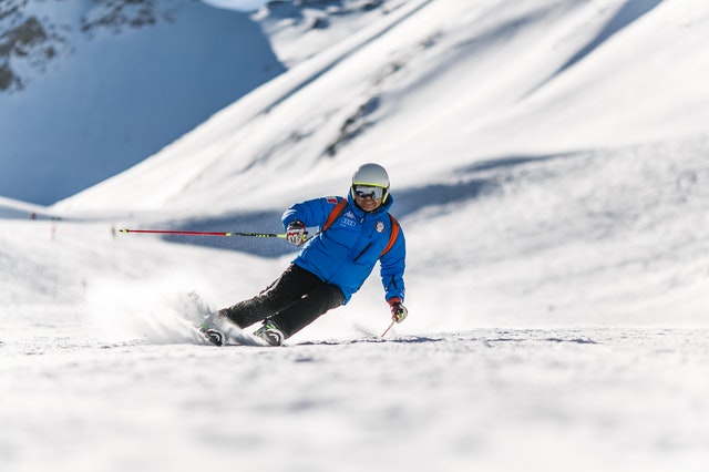 man skiing downhill