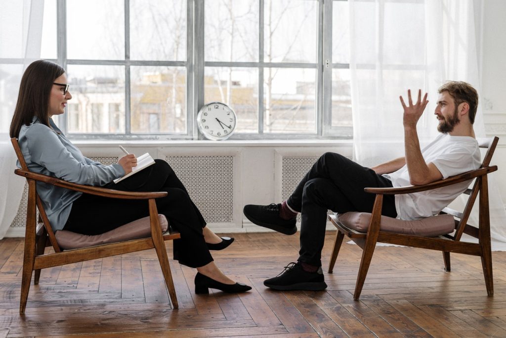 man talking to therapist about mental health
