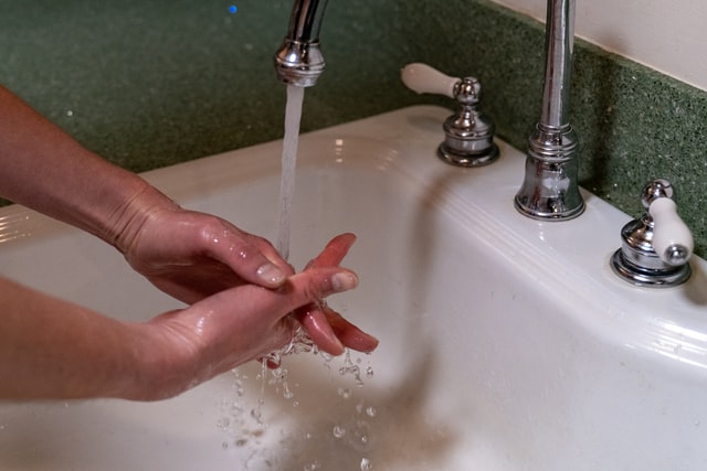 Regularly wash your hands to avoid getting sick while traveling