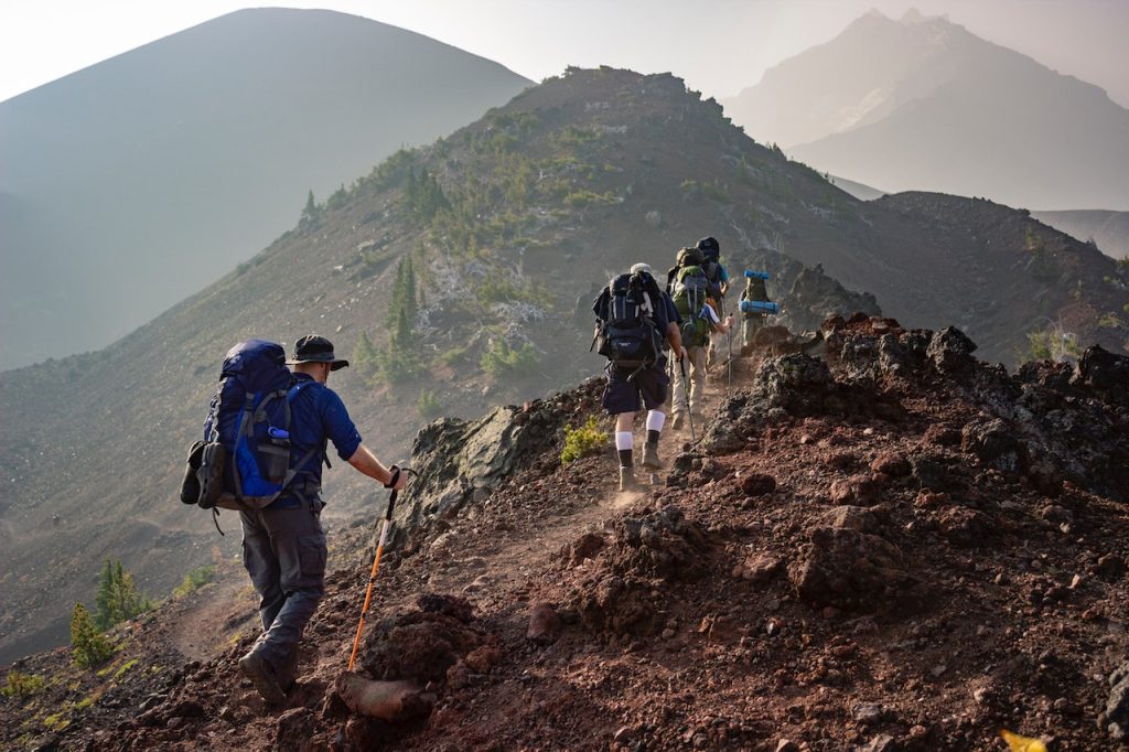 People climbing mountain while traveling