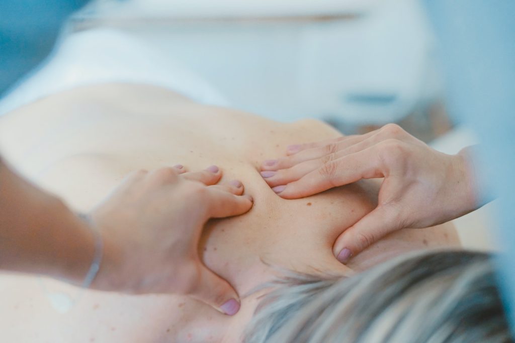 A patient receiving a massage