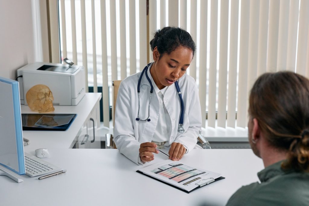 Physician assistant talking to a patient