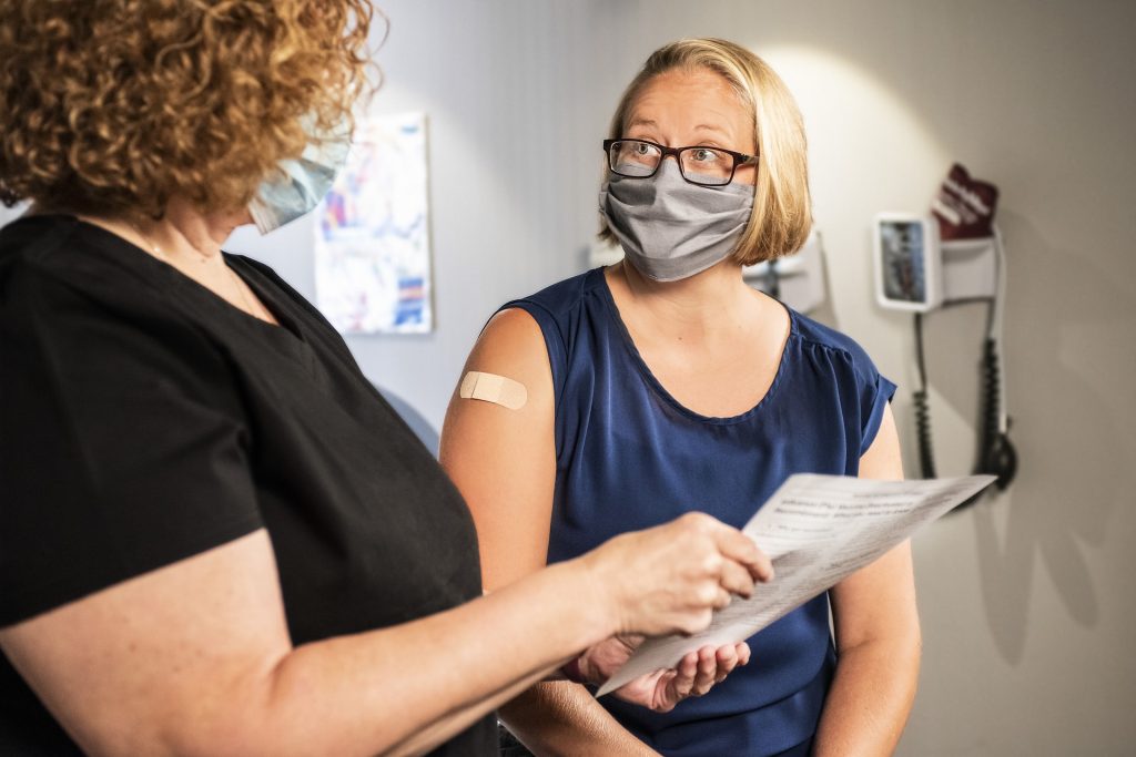 patient speaking with doctor about vaccination