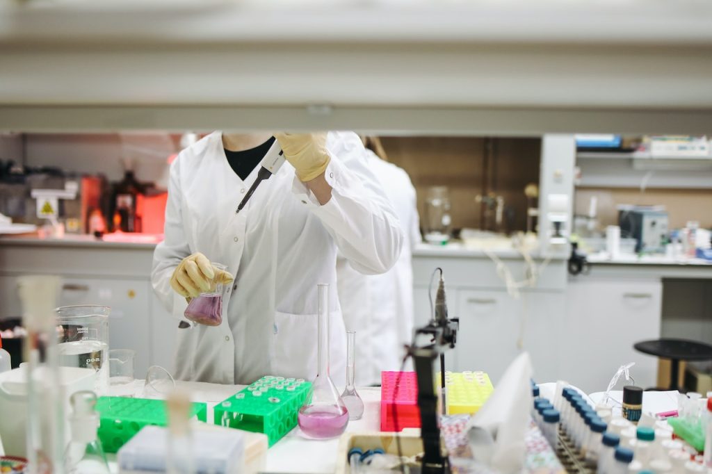 researcher testing vaccines in lab