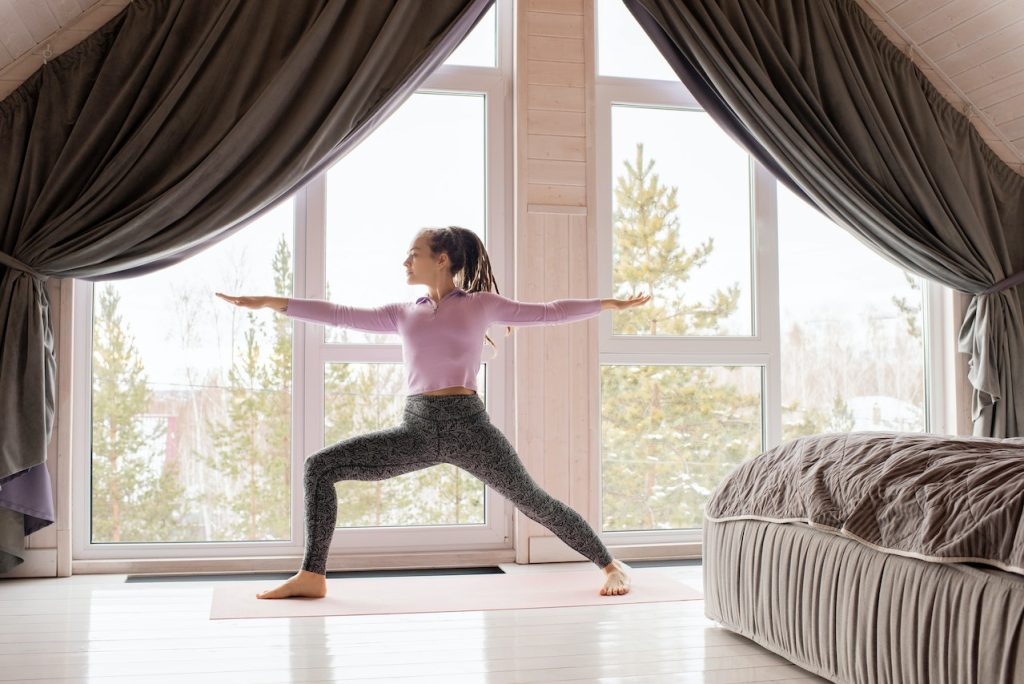 woman doing yoga at home