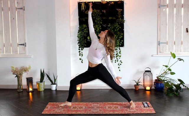 woman doing yoga to avoid holiday weight gain