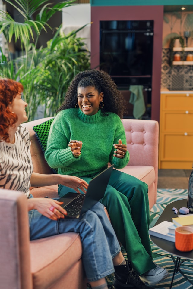 two women working at a startup and laughing