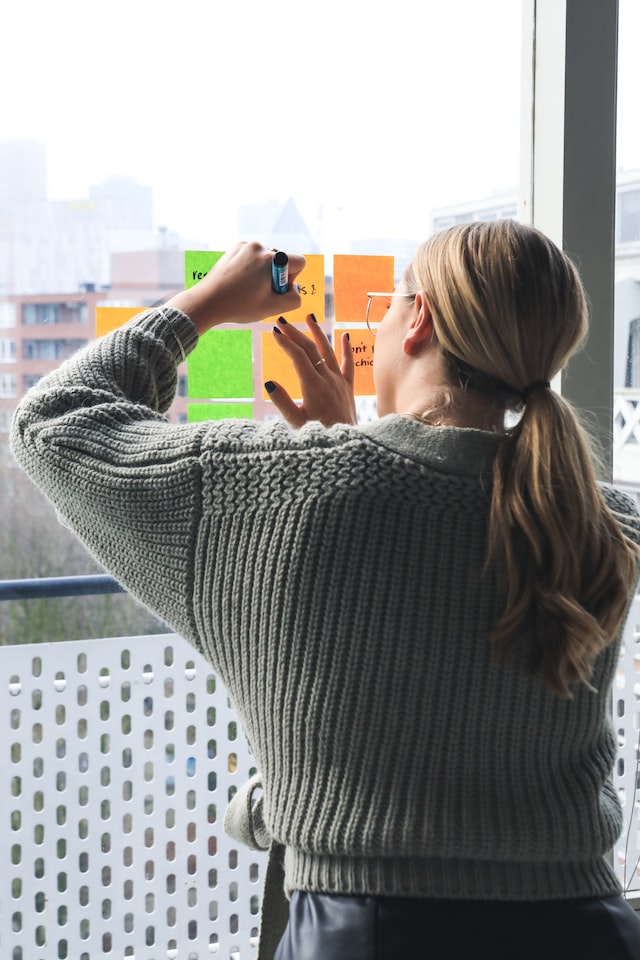 Startup founder brainstorming using sticky notes