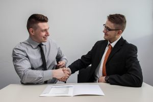 two men shaking hands