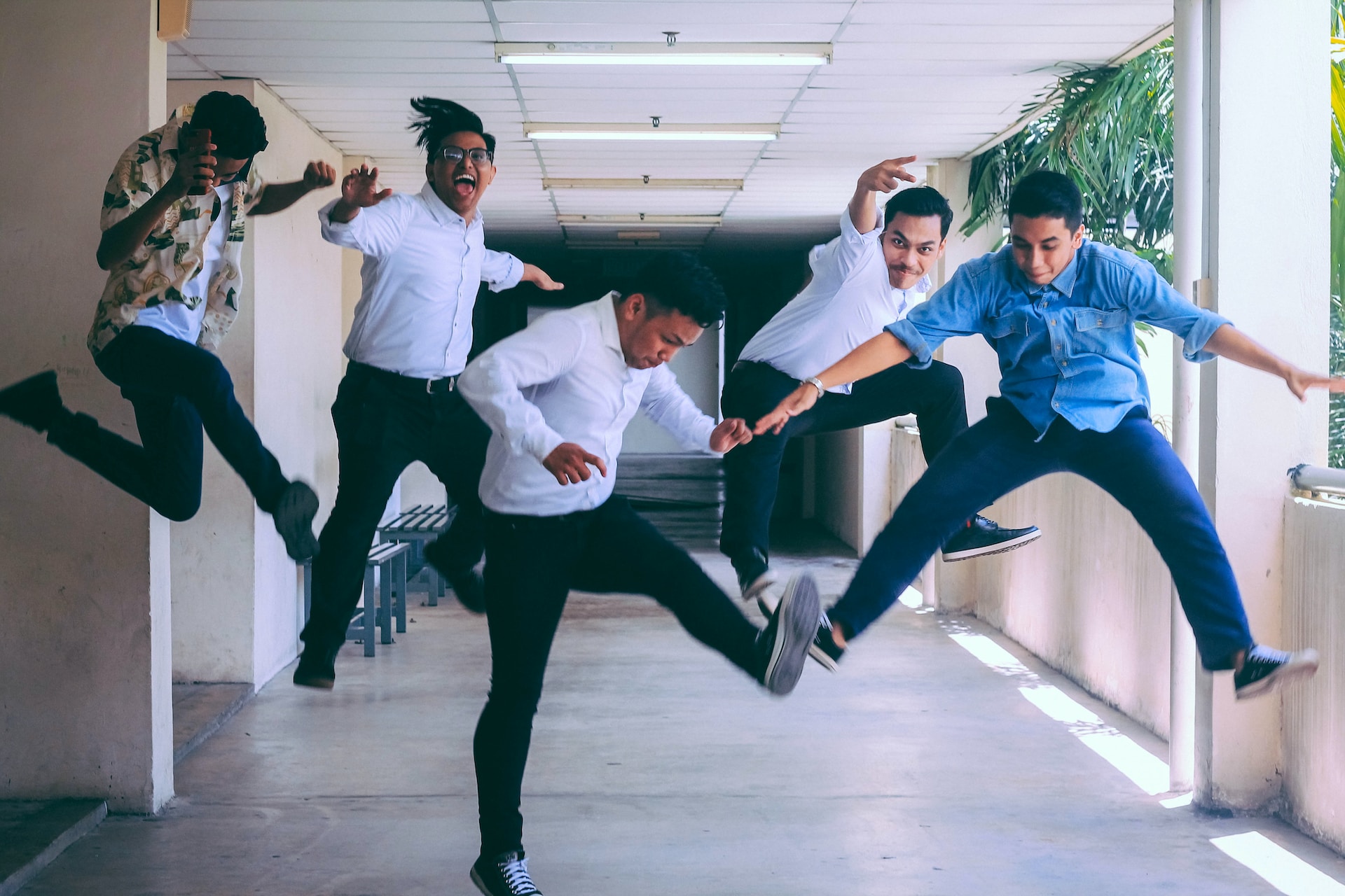 Employees jumping in the air