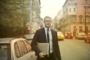 CEO carrying a laptop outside