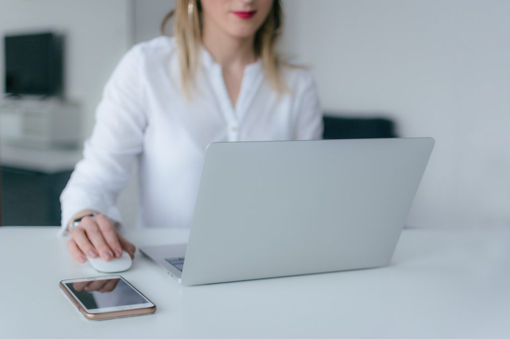 woman working on PPC ads on a laptop