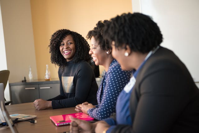 Team leaders and managers smiling during meeting